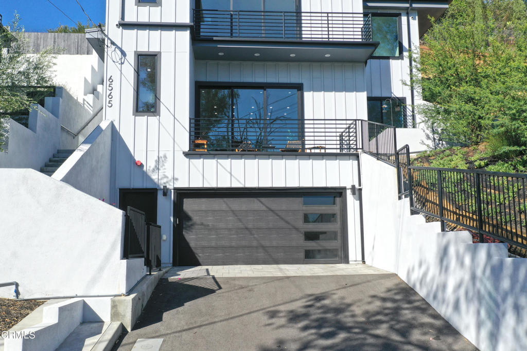 6565 Pickwick Street Los Angeles, CA 90042 - Photo 3 of 41 a front view of a house with a garage
