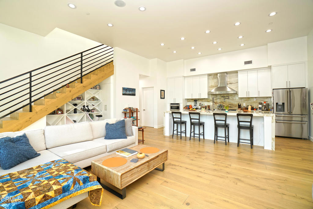 6565 Pickwick Street Los Angeles, CA 90042 - Photo 10 of 41 a living room with furniture and kitchen view with wooden floor