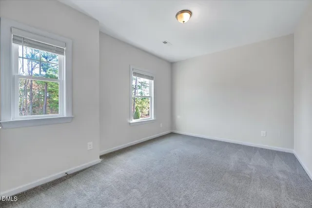 a view of a room with wooden floor and small space