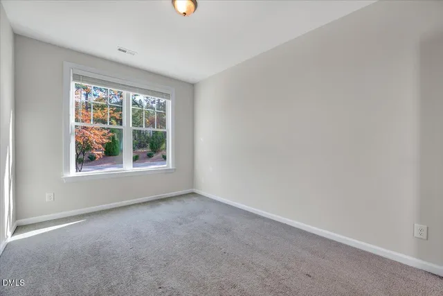 a bathroom with a toilet a sink and a mirror