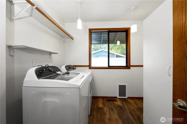 a utility room with closet dryer and washer