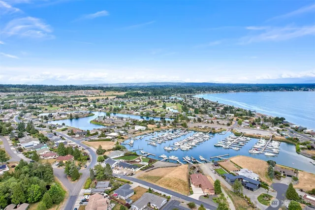 an aerial view of houses with yard