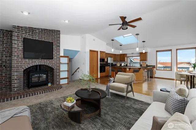 a living room with furniture fireplace and a flat screen tv