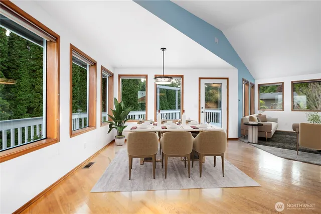 a view of a dining room with furniture window and wooden floor