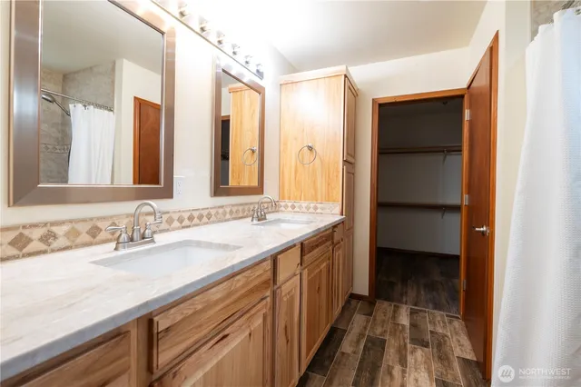a bathroom with a sink and a mirror