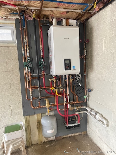 156 Triangle Street Danbury, CT 06810 - Photo 12 of 14 a view of walk in closet with clothes and shoes