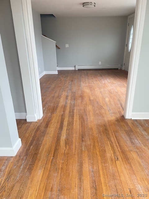 156 Triangle Street Danbury, CT 06810 - Photo 10 of 14 a view of a room with wooden floor and fence