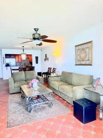 a living room with furniture and a table