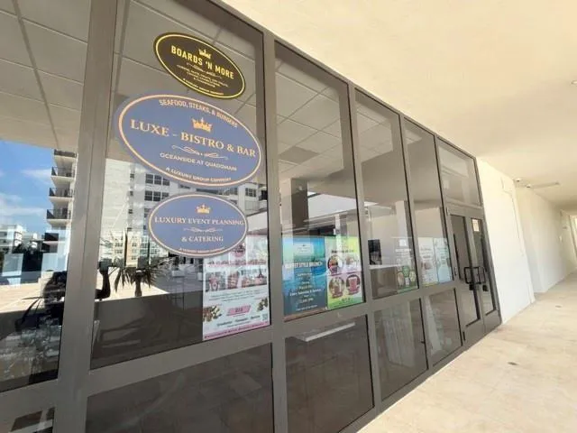 a room with pool table and windows