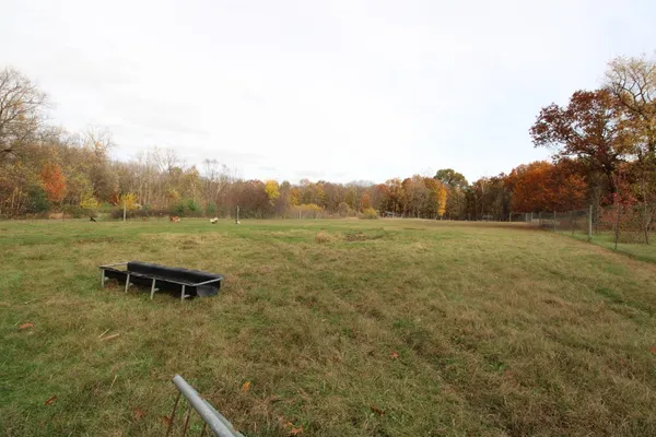 a view of a field with an outdoor space