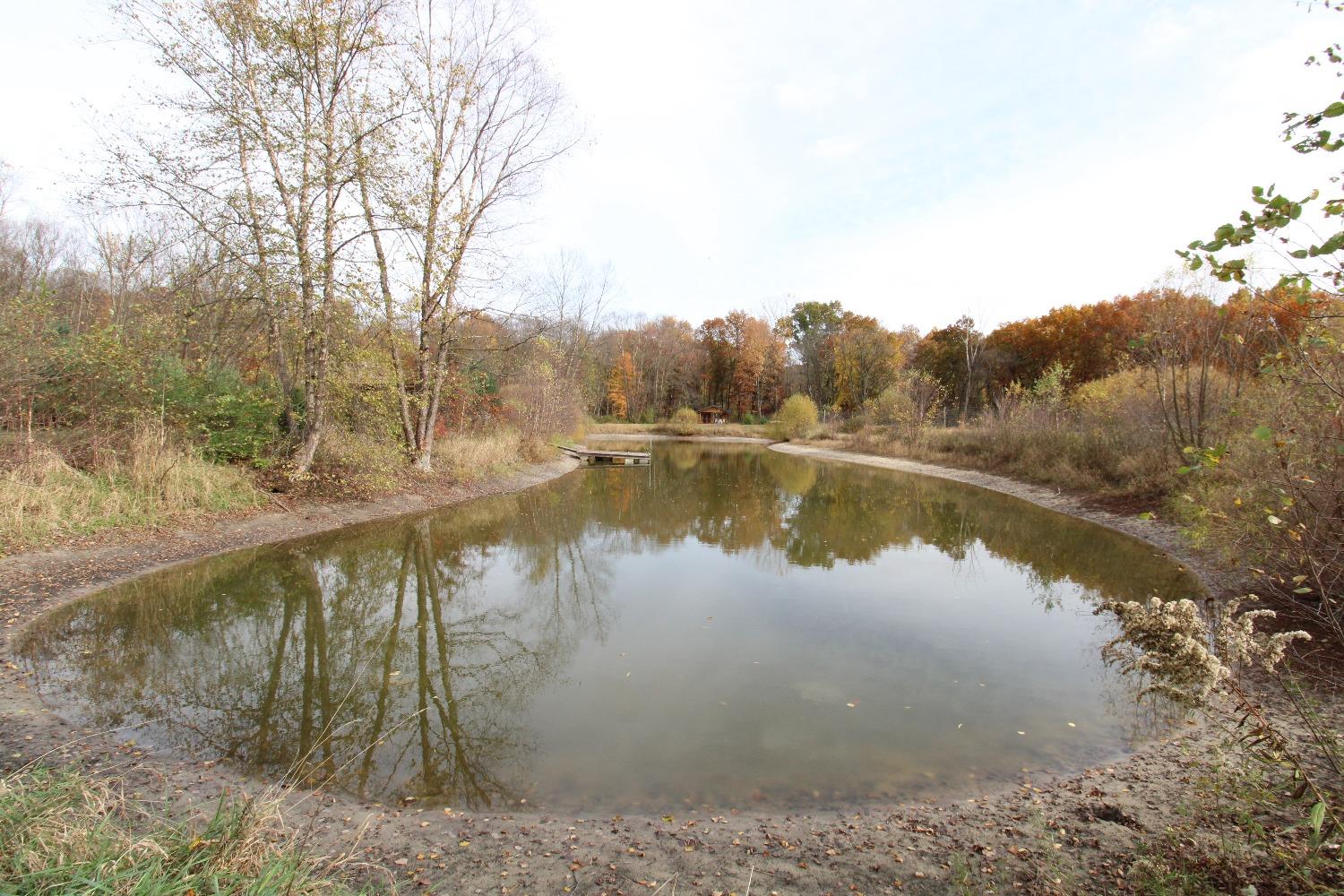 5742 South 350 East Knox, IN 46534 - Photo 17 of 32 a view of a lake with a mountain in the background