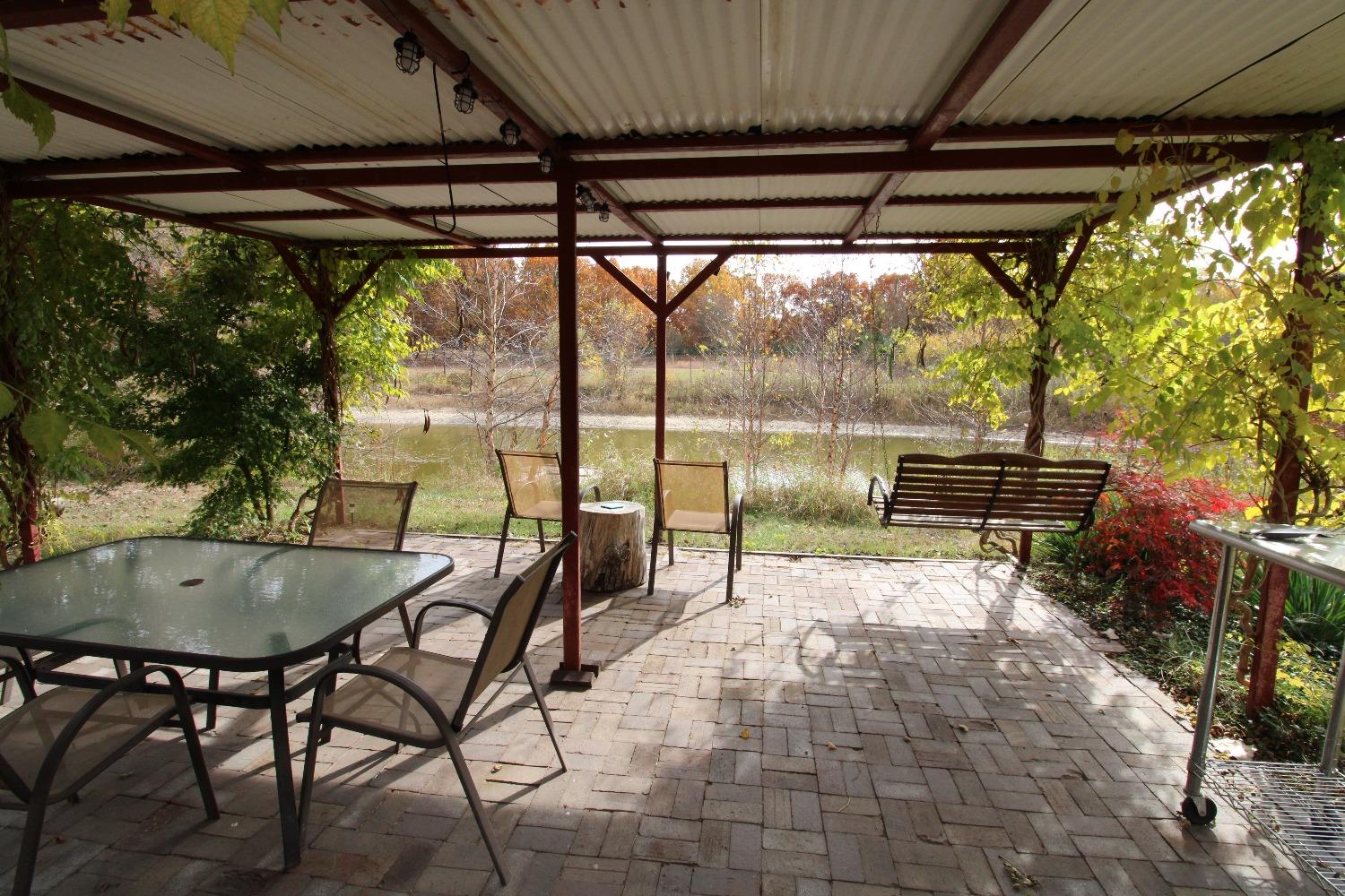 5742 South 350 East Knox, IN 46534 - Photo 24 of 32 a view of a patio with a table chairs and a table