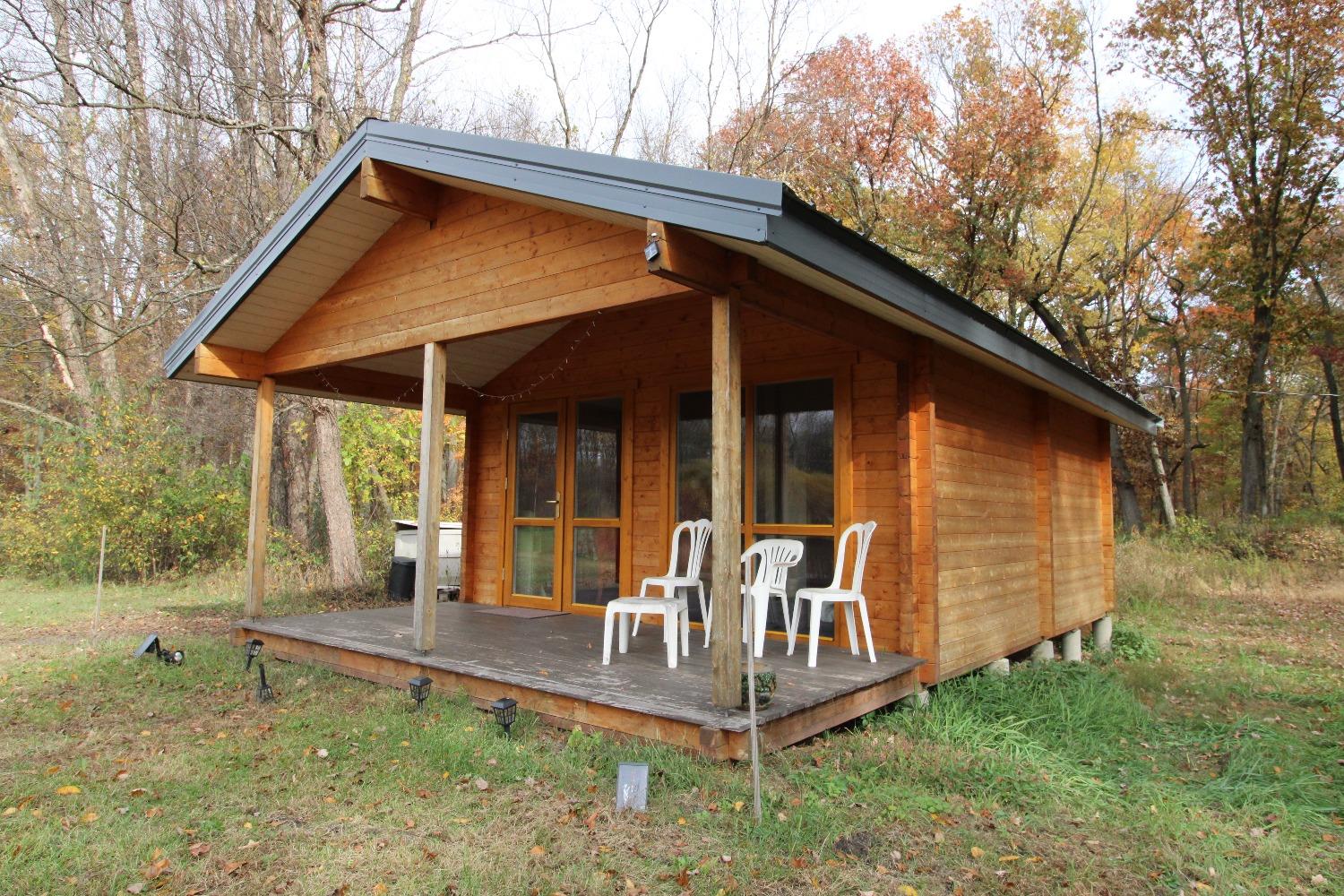 5742 South 350 East Knox, IN 46534 - Photo 25 of 32 a front view of a house with garden