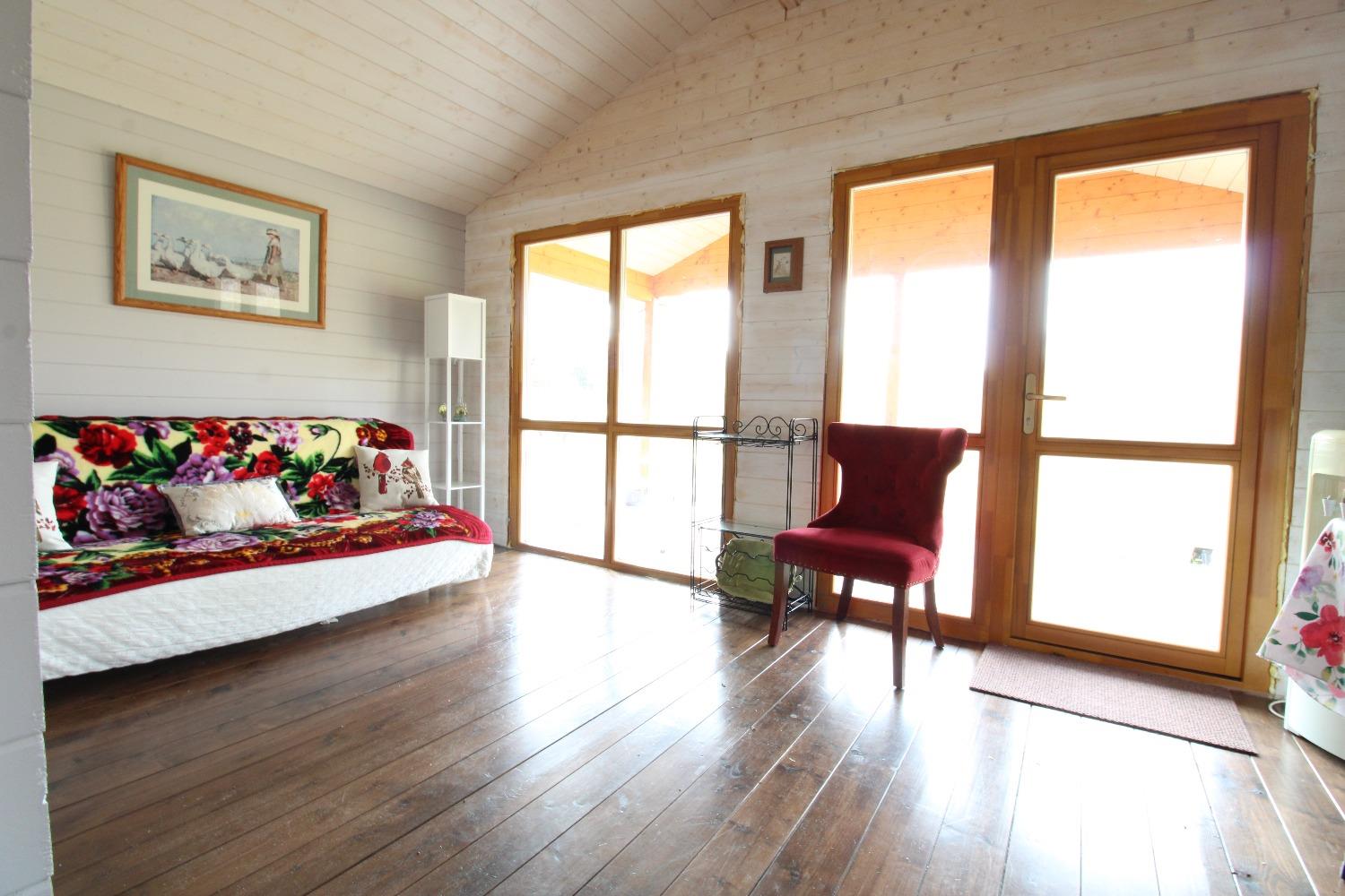 5742 South 350 East Knox, IN 46534 - Photo 29 of 32 a living room with furniture and a table next to a large window