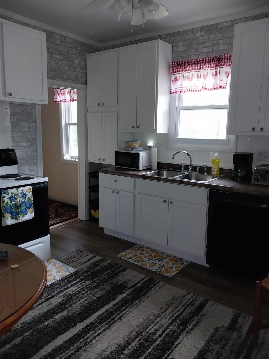 5742 South 350 East Knox, IN 46534 - Photo 3 of 32 a kitchen with a sink stove and cabinets