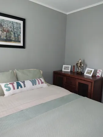 a bedroom with a bed and dresser