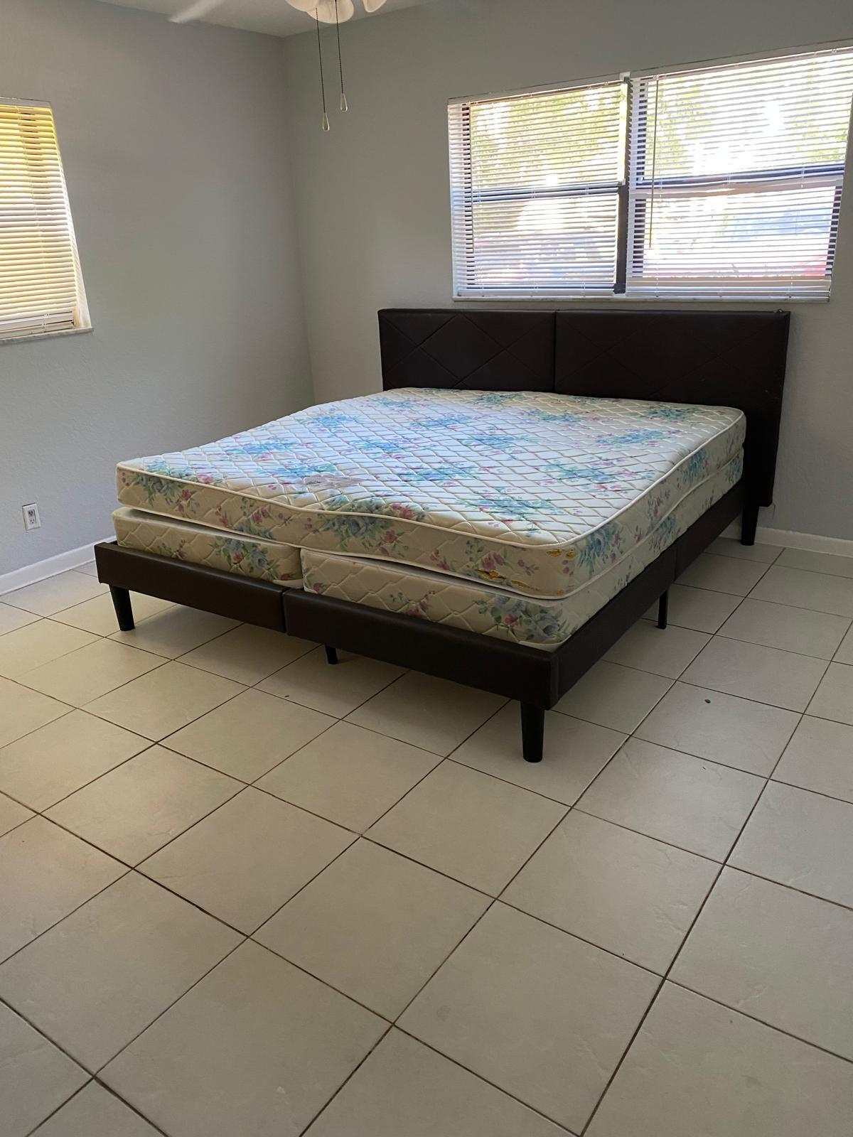 1195 Northwest 16th Avenue, Unit 10 Boca Raton, FL 33486 - Photo 11 of 13 a bedroom with a bed and window