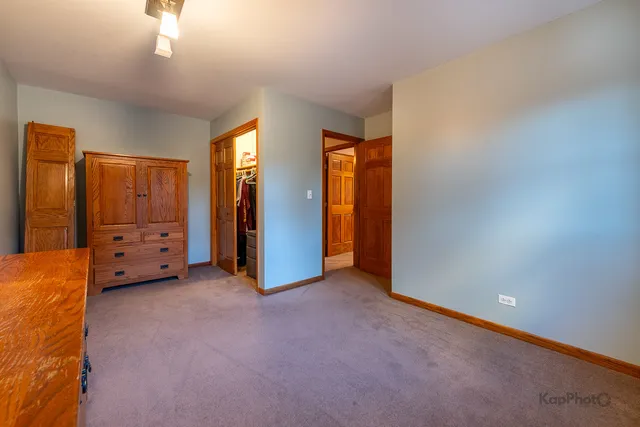 a view of an empty room with closet area