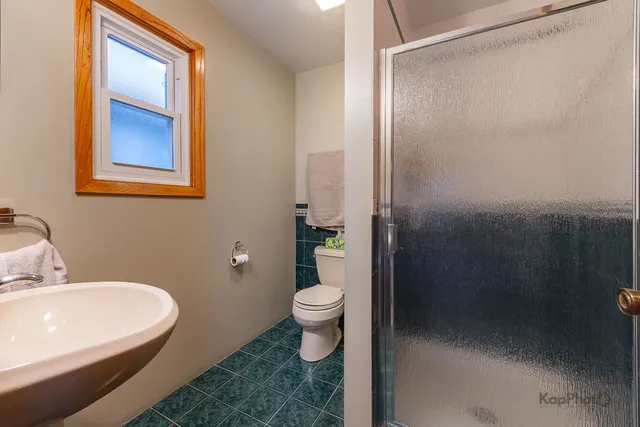 a bathroom with a sink and toilet