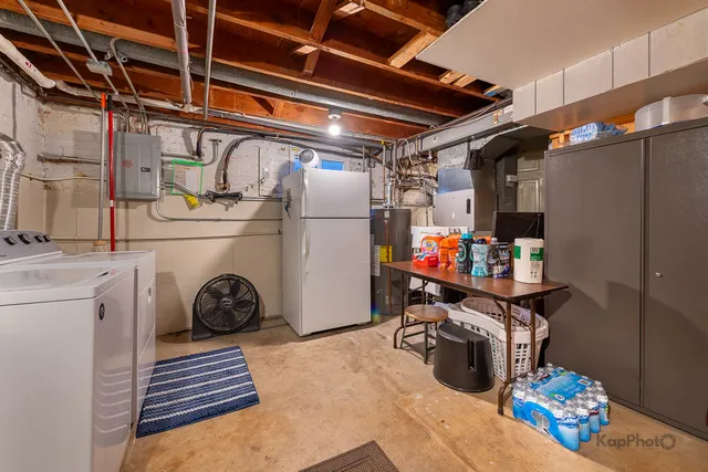 a storage and utility room with washer and dryer