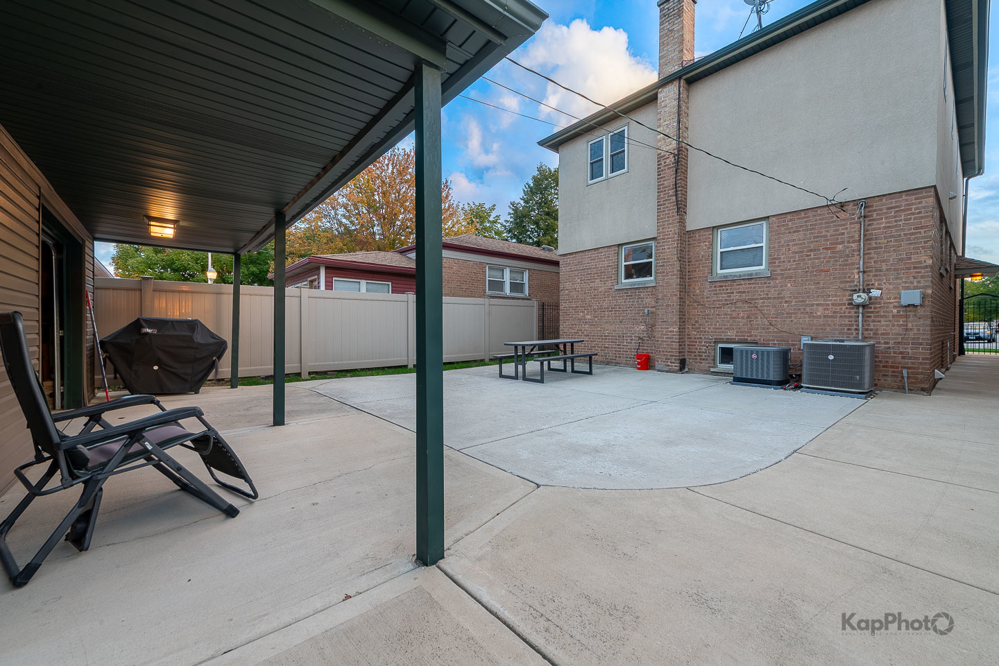 604 West 43rd Street Chicago, IL 60609 - Photo 29 of 30 a view of a patio with table and chairs a barbeque grill with wooden fence