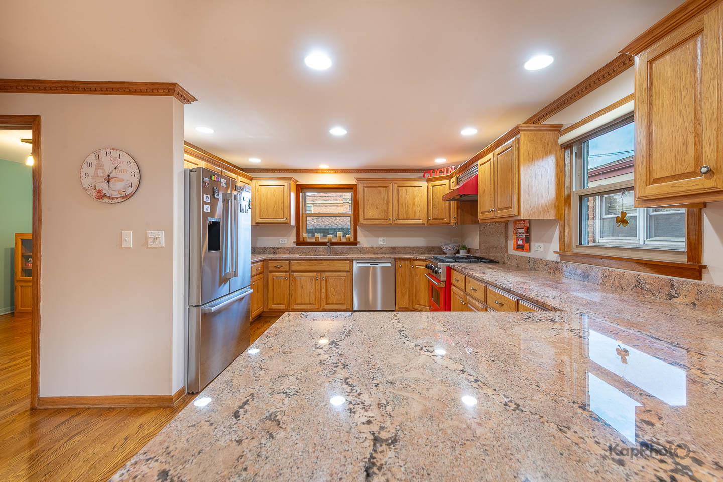 604 West 43rd Street Chicago, IL 60609 - Photo 9 of 30 a large kitchen with stainless steel appliances kitchen island granite countertop a refrigerator and a sink
