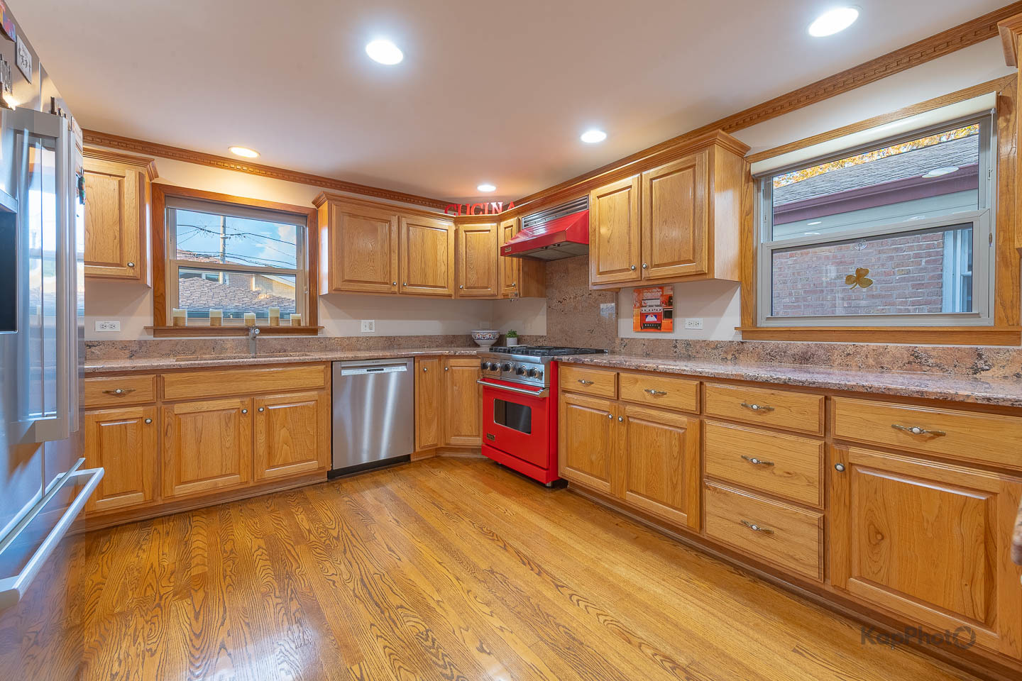 604 West 43rd Street Chicago, IL 60609 - Photo 10 of 30 a kitchen with stainless steel appliances granite countertop wooden cabinets sink and stove