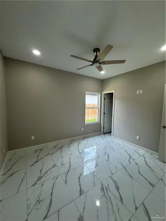 a view of an empty room and window