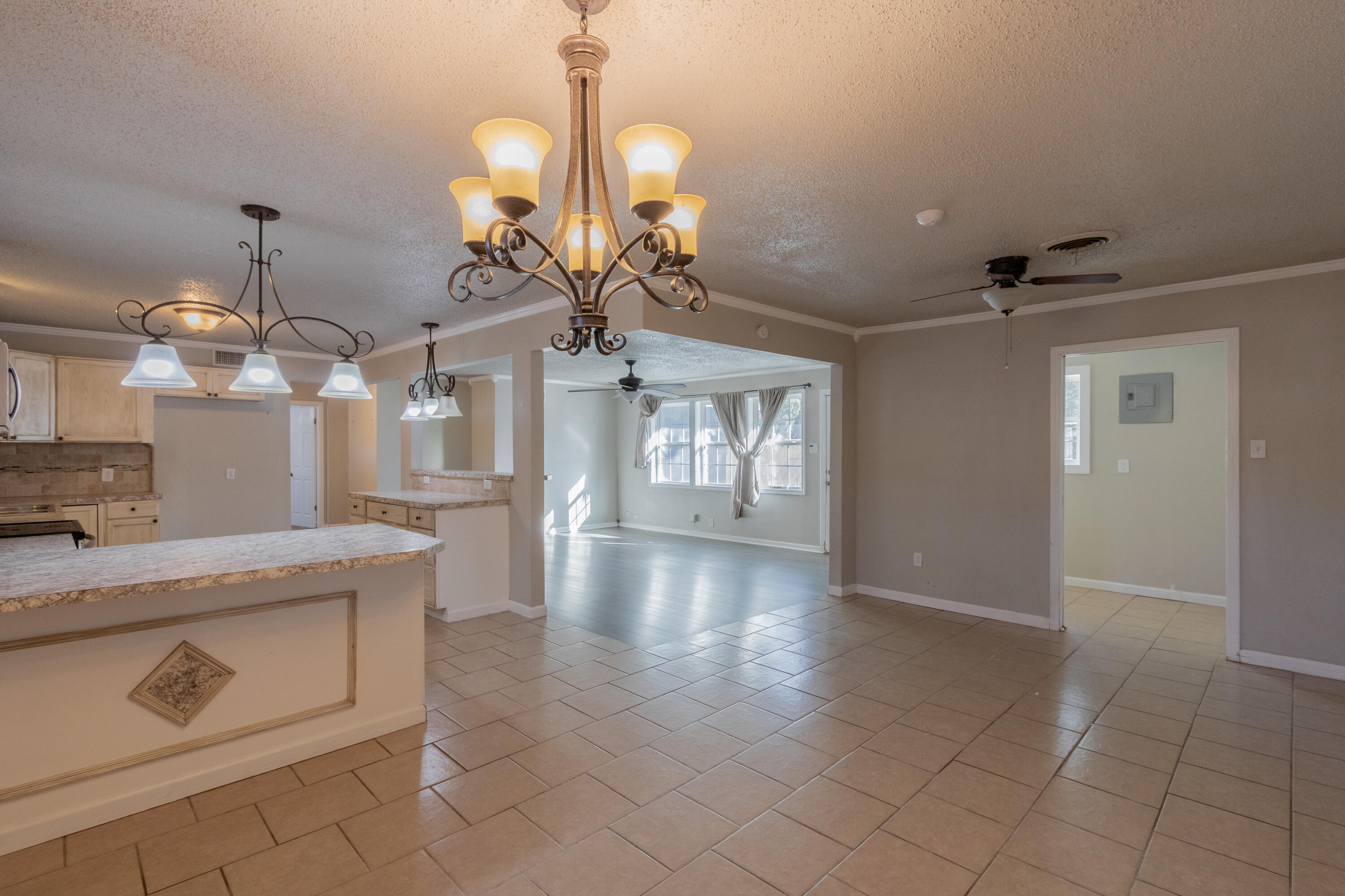 4021 38th Street Lubbock, TX 79413 - Photo 12 of 32 a view of a kitchen with a sink and chandelier