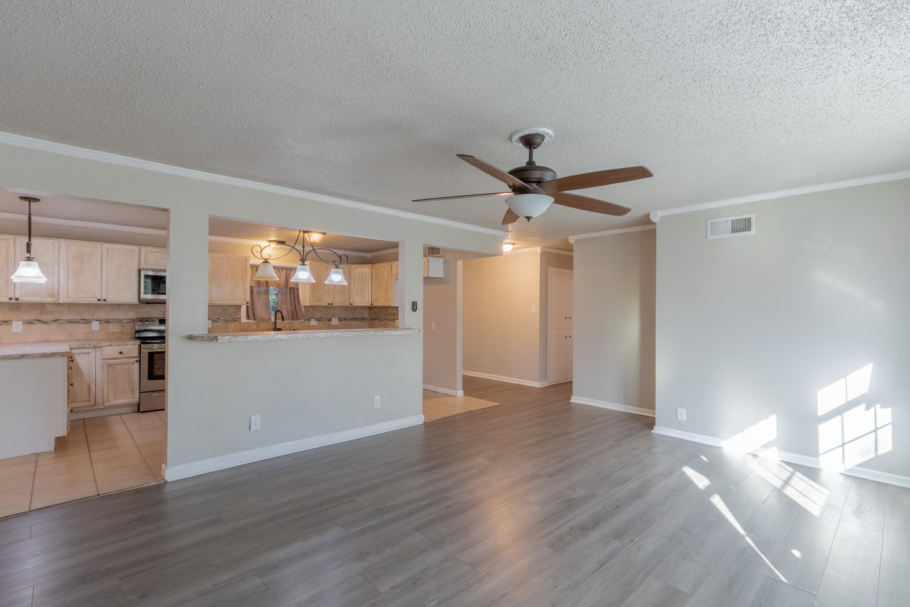 4021 38th Street Lubbock, TX 79413 - Photo 15 of 32 a view of a kitchen with a sink wooden floor and a kitchen