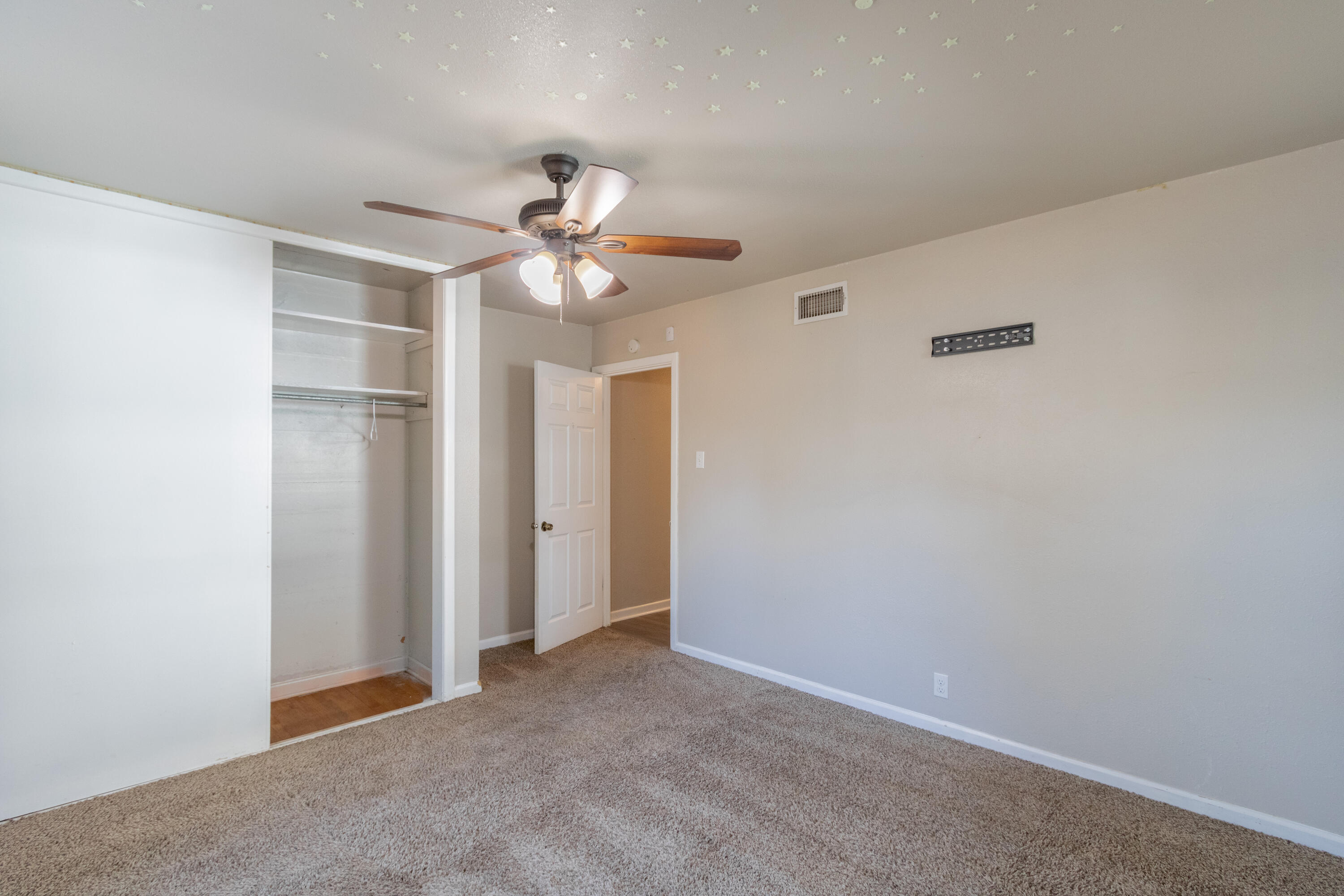 4021 38th Street Lubbock, TX 79413 - Photo 25 of 32 an empty room with a ceiling fan and a window
