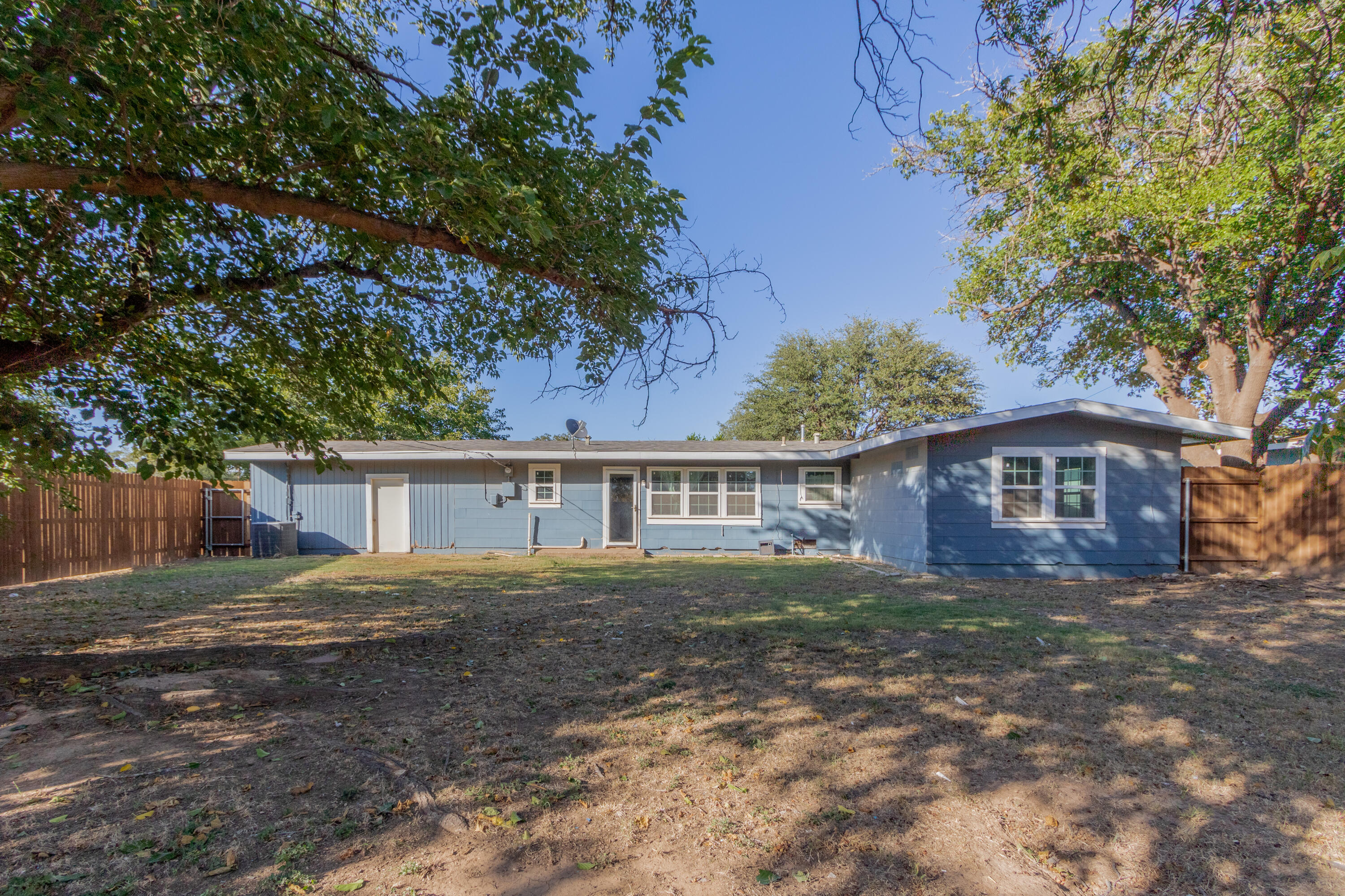 4021 38th Street Lubbock, TX 79413 - Photo 29 of 32 front view of a house with a yard