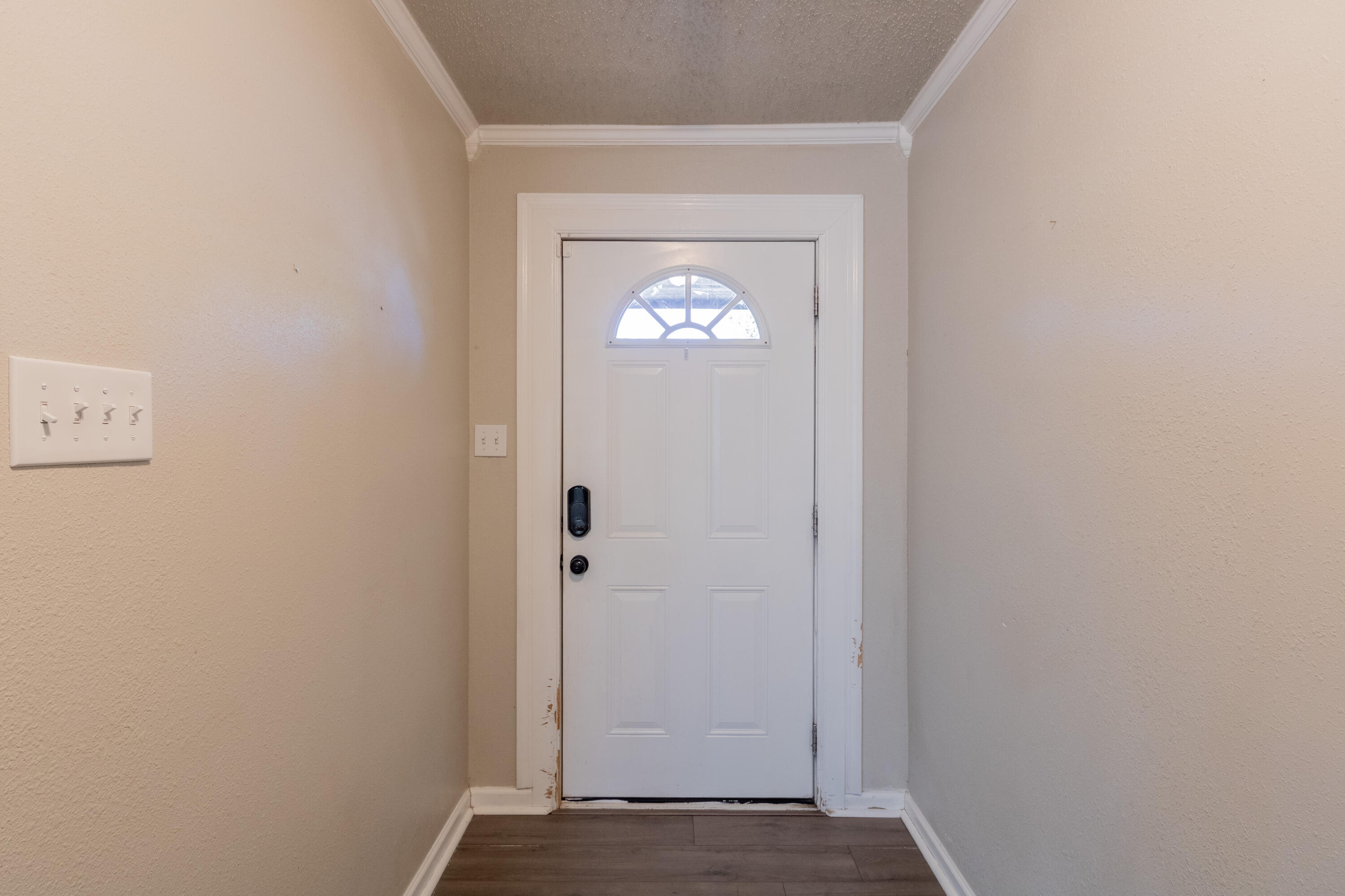 4021 38th Street Lubbock, TX 79413 - Photo 4 of 32 a view of an entryway with wooden floor