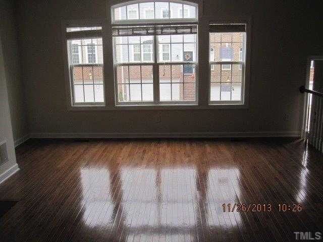 3122 Kentish Town Lane Raleigh, NC 27612 - Photo 4 of 11 a view of a room with wooden floor and windows