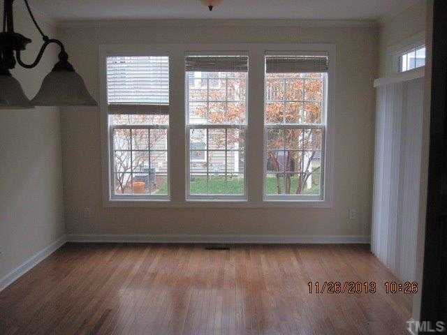 3122 Kentish Town Lane Raleigh, NC 27612 - Photo 5 of 11 a view of an empty room with a window