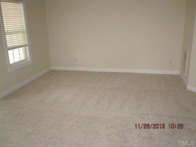 3122 Kentish Town Lane Raleigh, NC 27612 - Photo 8 of 11 a view of an empty room and window