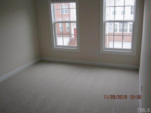 3122 Kentish Town Lane Raleigh, NC 27612 - Photo 9 of 11 an empty room with a window