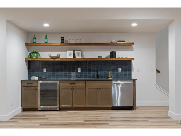 a kitchen with stainless steel appliances granite countertop a sink and cabinets