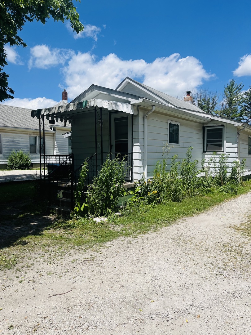 1213 East Main Street Streator, IL 61364 - Photo 18 of 18 a view of a house with garden and yard