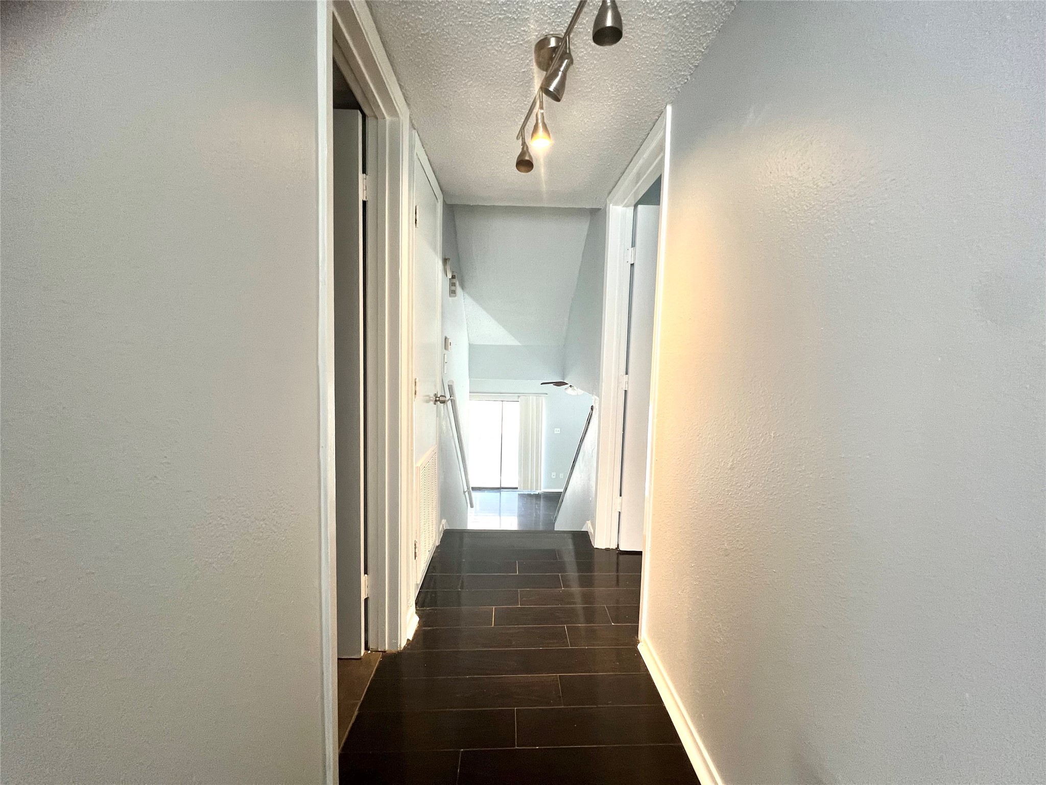 3754 Tanglewilde Street, Unit 9 Houston, TX 77063 - Photo 19 of 26 a view of a hallway with wooden floor and staircase