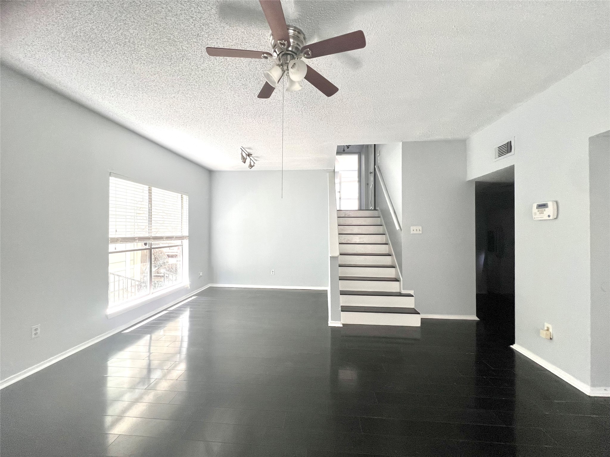 3754 Tanglewilde Street, Unit 9 Houston, TX 77063 - Photo 6 of 26 a view of an entryway with wooden floor