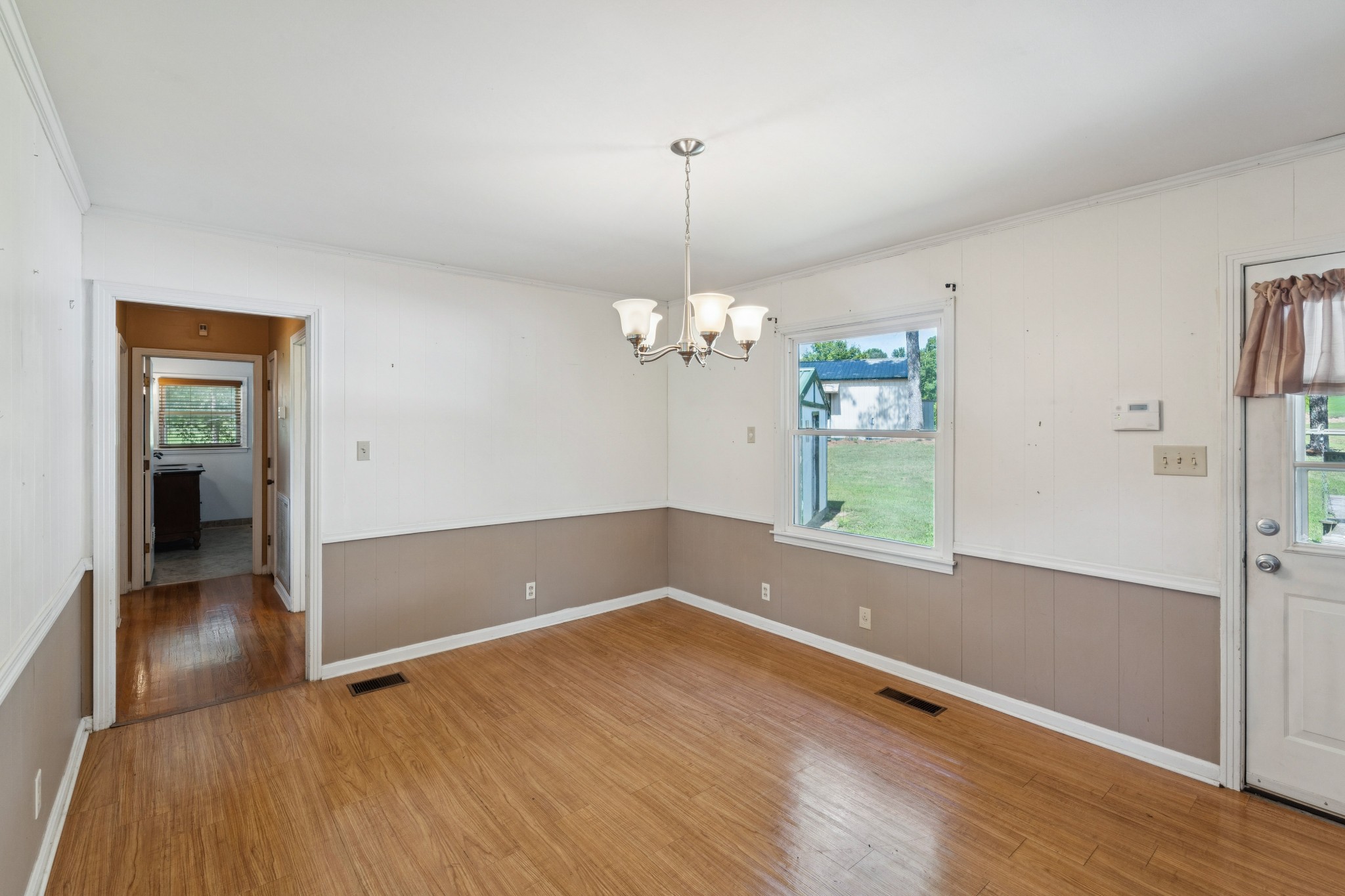 4272 Highway 49 Springfield, TN 37172 - Photo 17 of 50 a view of wooden floor in an empty room with a window