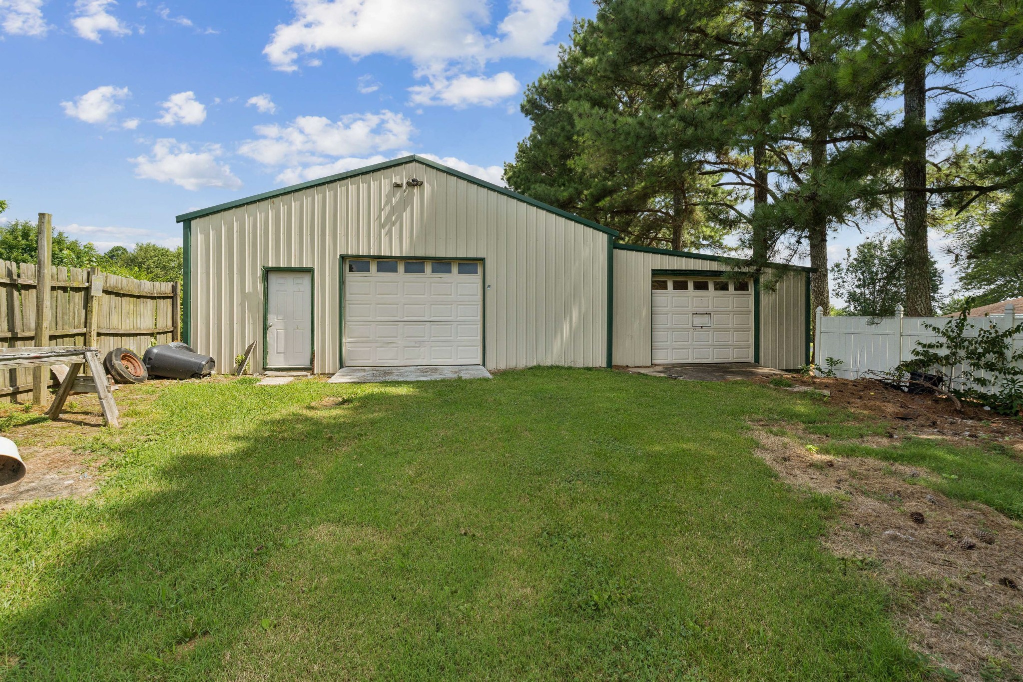4272 Highway 49 Springfield, TN 37172 - Photo 4 of 50 a backyard of a house with plants and large tree