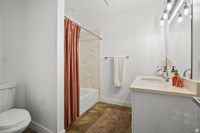 15008 South Springtime Road Draper, UT 84020 - Photo 34 of 37 Bathroom with vanity, shower / tub combo, and concrete flooring