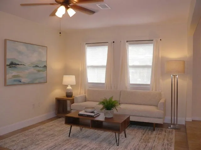 a view of a kitchen with a sink and a refrigerator