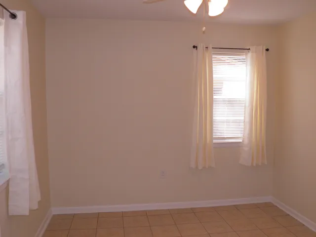 a bathroom with a bath tub with a shower
