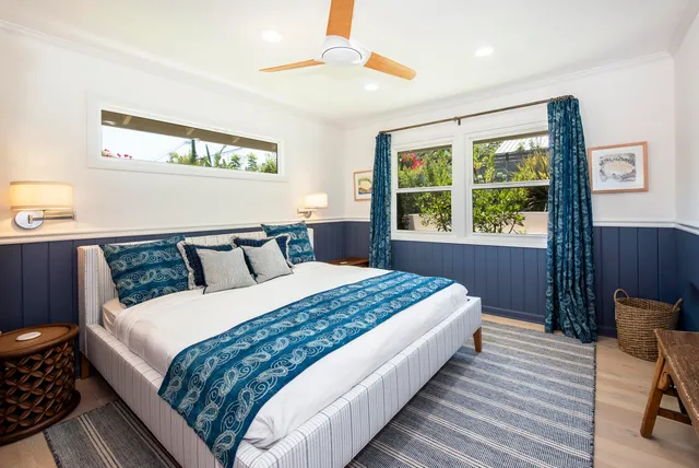 a bedroom with bed and a window