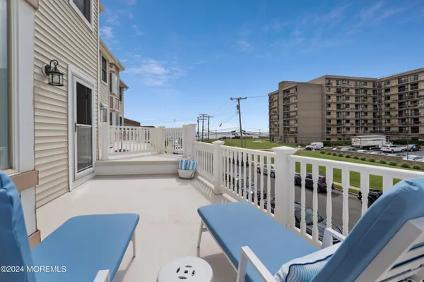 a view of balcony with furniture