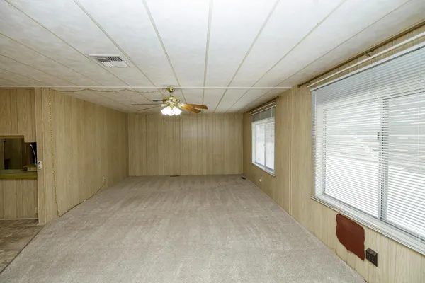 a view of an empty room with windows