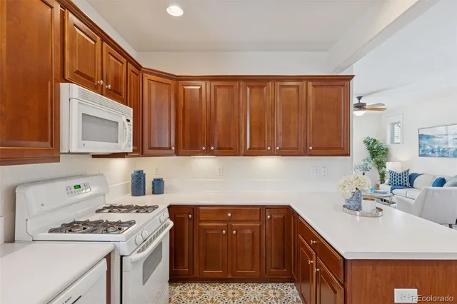 a kitchen with a sink cabinets and stove top oven
